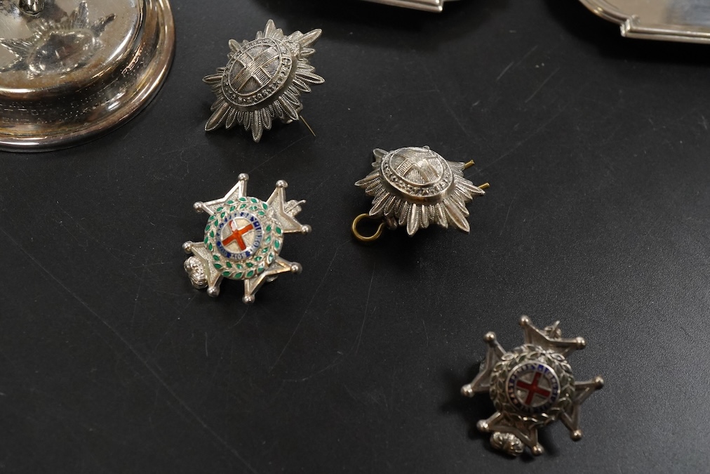 A pair of late Victorian Regimental silver menu holders (Royal Sussex Regiment), a pair of ashtrays and two pairs of uniform pips first height 5cm., weight approx. 7.83ozt